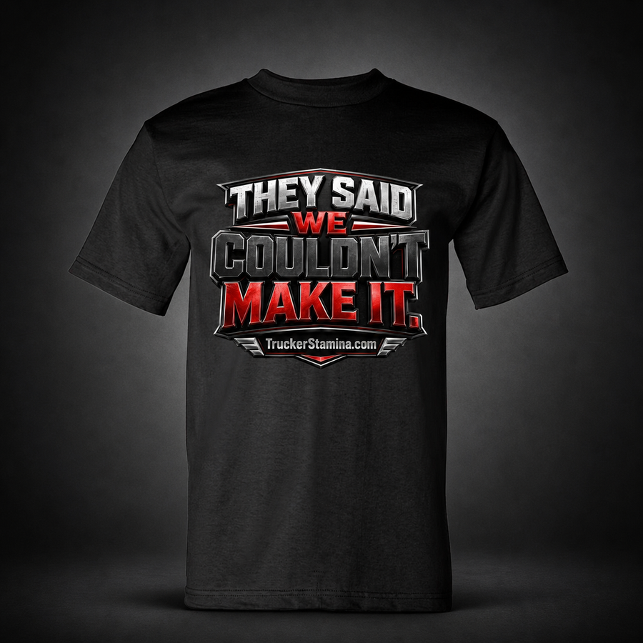 They Said We Couldn’t Make It black trucker T-shirt on charcoal studio background